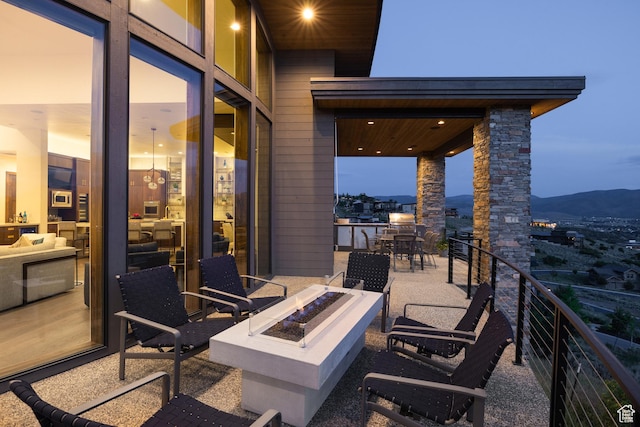 1703 N Chimney Rock Rd Unit 532, Heber City, UT 84032 - view of patio / terrace with a fire pit, a mountain view, and a balcony