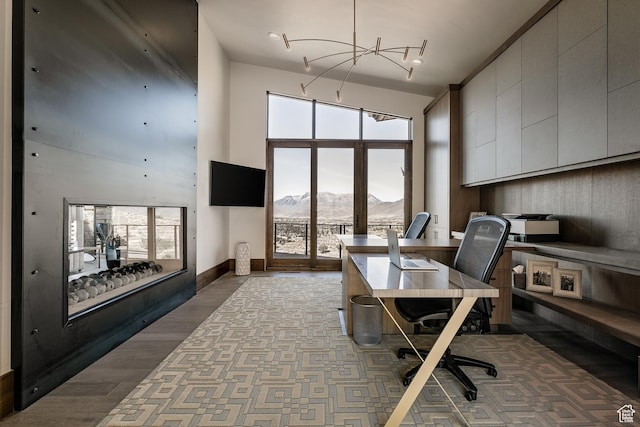 1703 N Chimney Rock Rd Unit 532, Heber City, UT 84032 - office space featuring a towering ceiling, a chandelier, baseboards, and wood finished floors