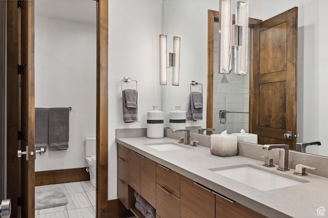 1703 N Chimney Rock Rd Unit 532, Heber City, UT 84032 - full bath featuring toilet, double vanity, marble look tile flooring, and baseboards