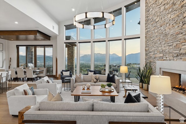 1703 N Chimney Rock Rd Unit 532, Heber City, UT 84032 - living room featuring a mountain view, wood finished floors, plenty of natural light, a high ceiling, and recessed lighting