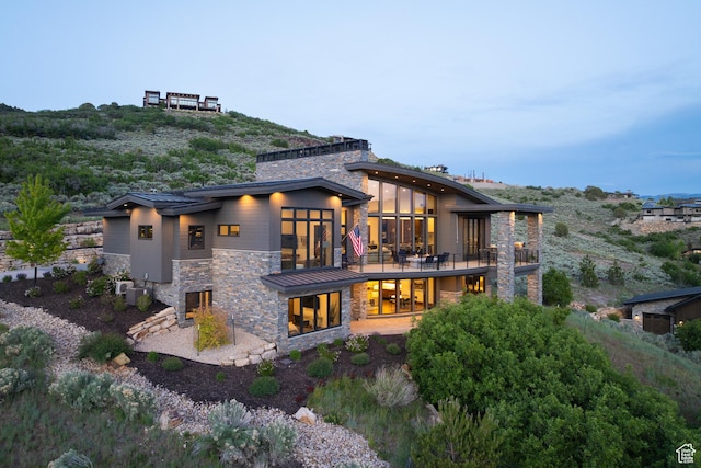 1703 N Chimney Rock Rd Unit 532, Heber City, UT 84032 - back of property with stone siding and a chimney