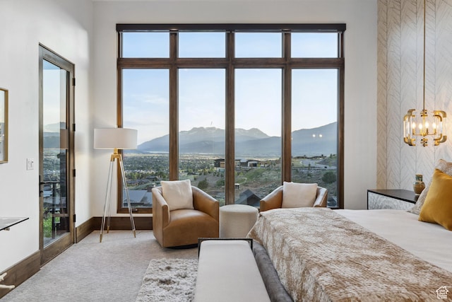 1703 N Chimney Rock Rd Unit 532, Heber City, UT 84032 - bedroom featuring a mountain view, a chandelier, and baseboards