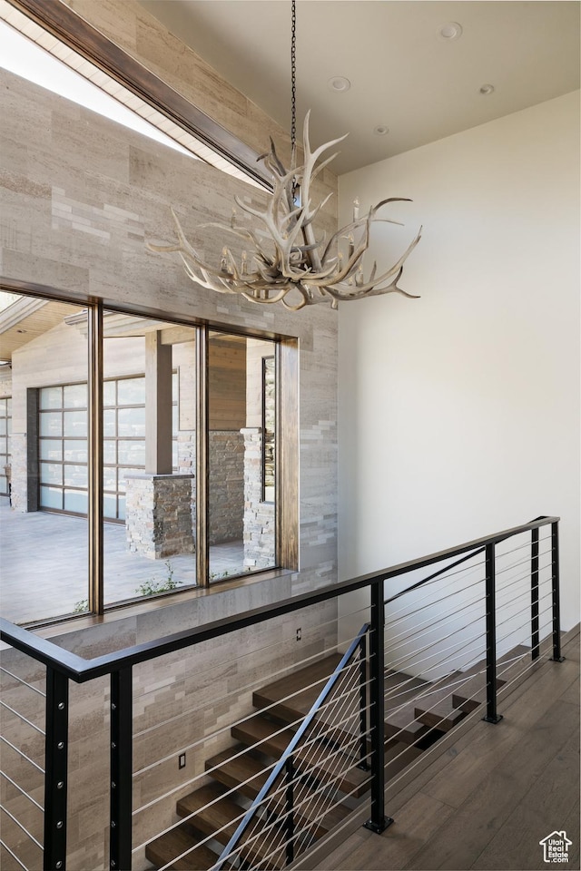 1703 N Chimney Rock Rd Unit 532, Heber City, UT 84032 - stairway with a chandelier, wood finished floors, and recessed lighting