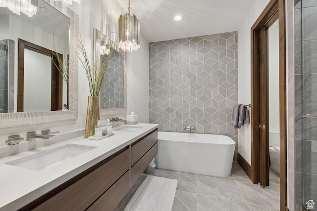 1703 N Chimney Rock Rd Unit 532, Heber City, UT 84032 - full bathroom featuring tile walls, a freestanding bath, double vanity, toilet, and recessed lighting