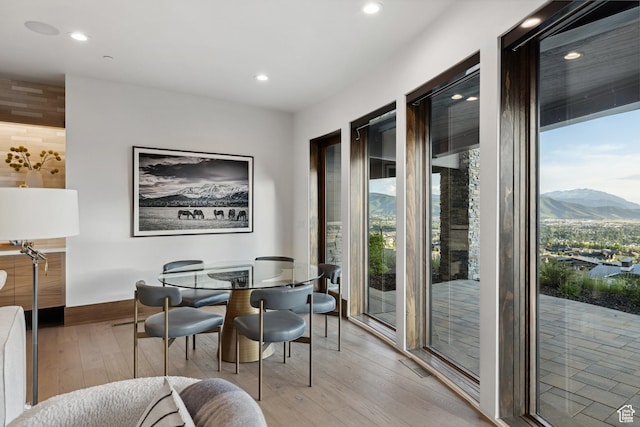 1703 N Chimney Rock Rd Unit 532, Heber City, UT 84032 - dining space featuring plenty of natural light, light wood finished floors, a mountain view, recessed lighting, and baseboards