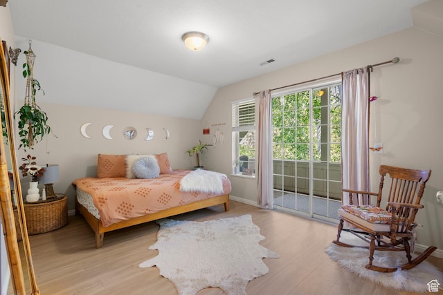 2692 S Grand Oak Cir E, Bountiful, UT 84010 - bedroom featuring access to outside, light wood-type flooring, vaulted ceiling, and baseboards