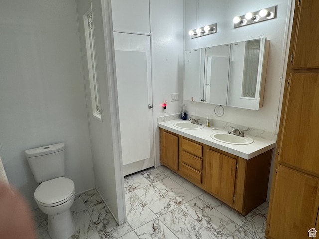 6153 E 2000 N, Roosevelt, UT 84066 - bathroom with marble finish floors, double vanity, and toilet