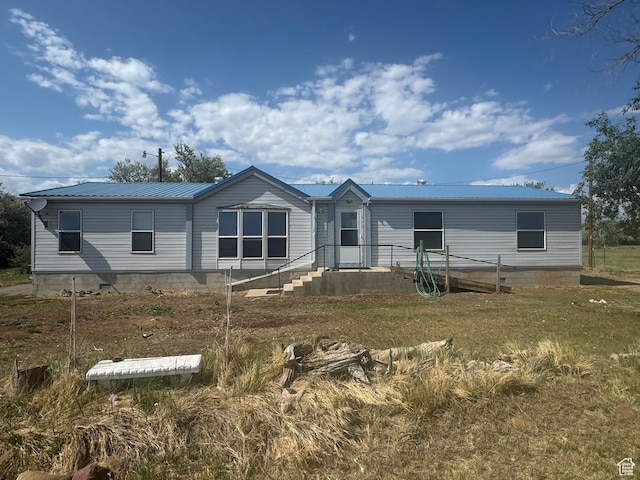 6153 E 2000 N, Roosevelt, UT 84066 - rear view of house featuring metal roof