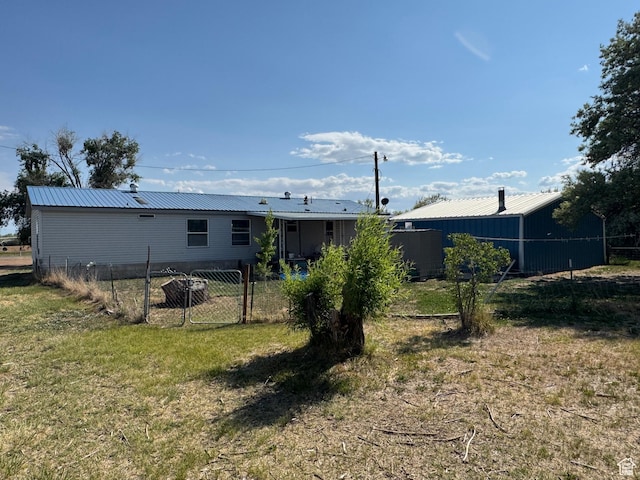 6153 E 2000 N, Roosevelt, UT 84066 - rear view of house featuring metal roof