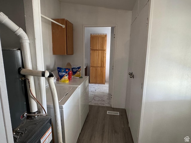 6153 E 2000 N, Roosevelt, UT 84066 - washroom featuring washing machine and dryer, wood finished floors, and cabinet space