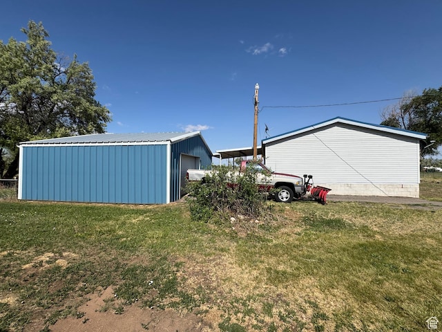 6153 E 2000 N, Roosevelt, UT 84066 - view of grassy yard featuring an outdoor structure and a detached garage