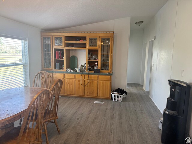 6153 E 2000 N, Roosevelt, UT 84066 - dining room featuring vaulted ceiling and wood finished floors