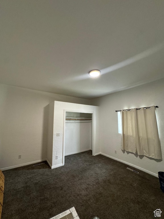 188 E 100 N, Nephi, UT 84648 - unfurnished bedroom featuring dark colored carpet and a closet
