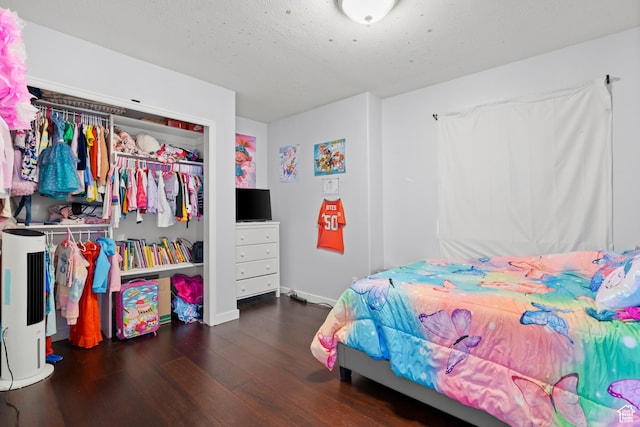 8002 S Overton Dr, West Jordan, UT 84081 - bedroom with wood finished floors, a closet, a textured ceiling, and water heater