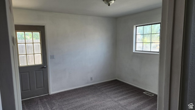 1896 W Homestead Farms Ln Unit 3, Salt Lake City, UT 84119 - spare room featuring dark carpet and baseboards