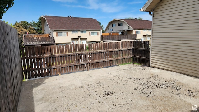 1896 W Homestead Farms Ln Unit 3, Salt Lake City, UT 84119 - view of patio featuring a residential view