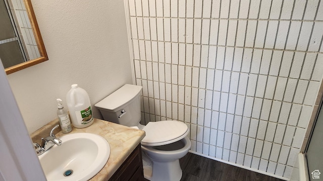 1896 W Homestead Farms Ln Unit 3, Salt Lake City, UT 84119 - bathroom featuring toilet, wood finished floors, and vanity