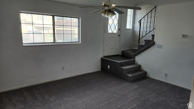 1896 W Homestead Farms Ln Unit 3, Salt Lake City, UT 84119 - unfurnished living room with dark colored carpet, a ceiling fan, stairs, and baseboards