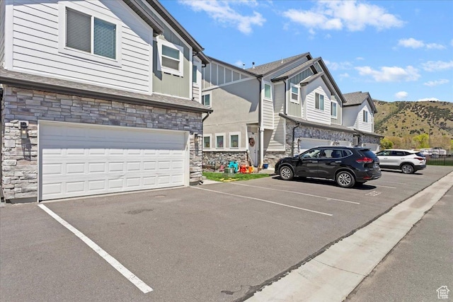 290 N 100 W, Morgan, UT 84050 - view of front of house featuring stone siding, uncovered parking, and a mountain view