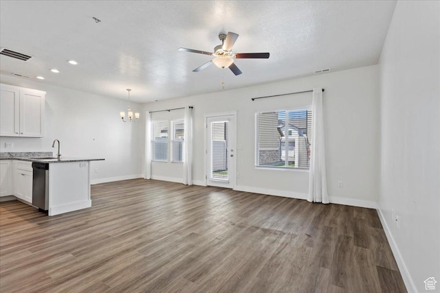 290 N 100 W, Morgan, UT 84050 - unfurnished living room with a chandelier, a sink, wood finished floors, baseboards, and ceiling fan