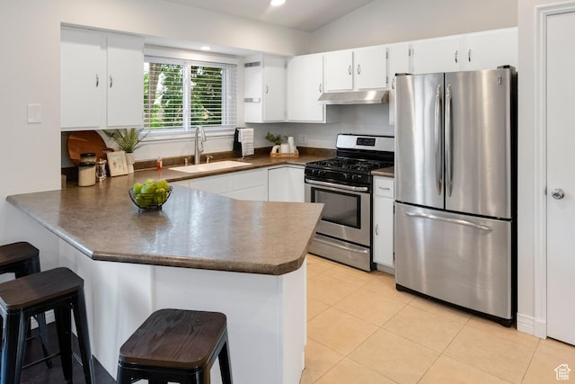 1022 E Lafayette St S, Sandy, UT 84094 - kitchen with stainless steel appliances, under cabinet range hood, a sink, a peninsula, and dark countertops