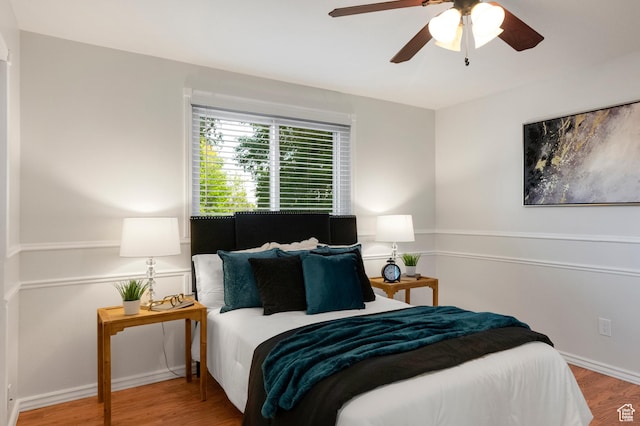 1022 E Lafayette St S, Sandy, UT 84094 - bedroom with wood finished floors, ceiling fan, and baseboards