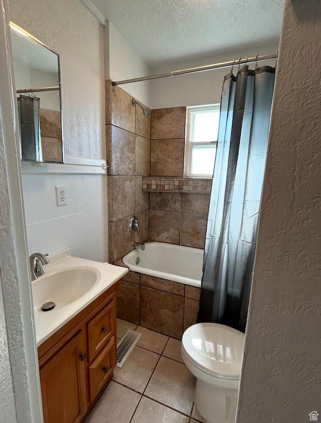 115 N 300 E, Payson, UT 84651 - full bathroom featuring tiled shower / bath, a textured ceiling, vanity, tile patterned flooring, and toilet