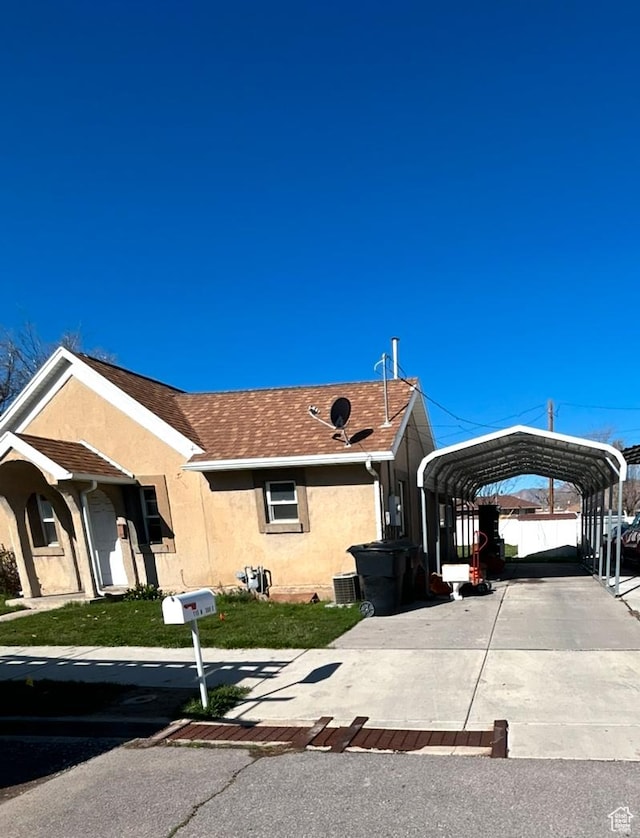 115 N 300 E, Payson, UT 84651 - single story home featuring stucco siding, a carport, driveway, and a shingled roof