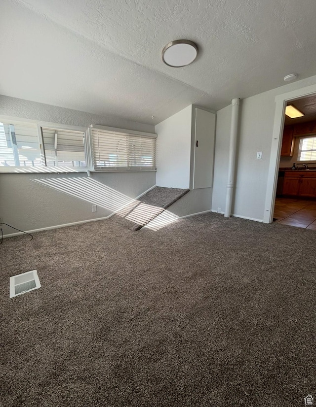 115 N 300 E, Payson, UT 84651 - empty room with a textured ceiling, carpet floors, baseboards, and a sink