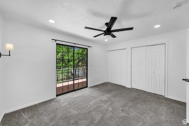 2158 W 70 S, Hurricane, UT 84737 - unfurnished bedroom featuring access to outside, a textured ceiling, multiple closets, baseboards, and carpet flooring