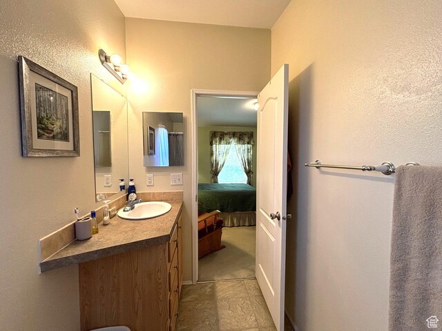 380 Portal Vista Loop, Moab, UT 84532 - bathroom featuring vanity and connected bathroom