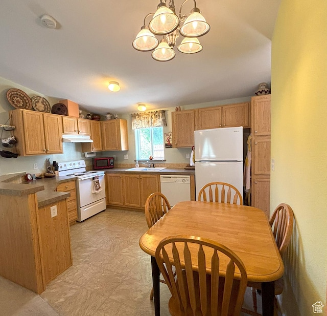 380 Portal Vista Loop, Moab, UT 84532 - kitchen with white appliances, a chandelier, under cabinet range hood, a sink, and pendant lighting