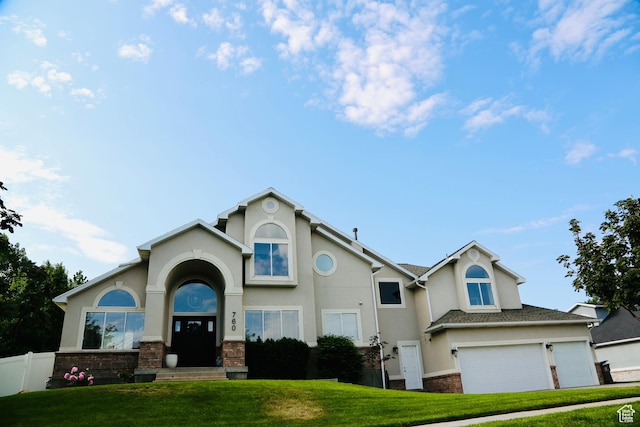 760 E Corner Ridge Dr, Draper, UT 84020 - view of front of house with stucco siding, a garage, and stone siding
