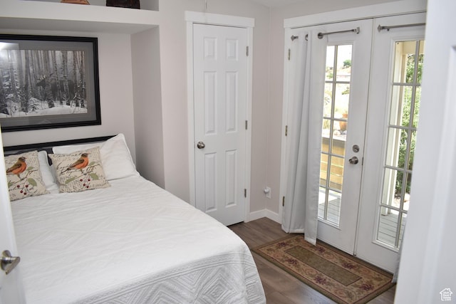 527 S Moenkopi Dr, Leeds, UT 84746 - bedroom featuring wood finished floors, access to exterior, and baseboards