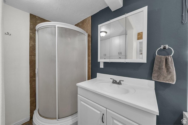 183 W 200 N, Hurricane, UT 84737 - bathroom with a shower stall, vanity, and a textured ceiling