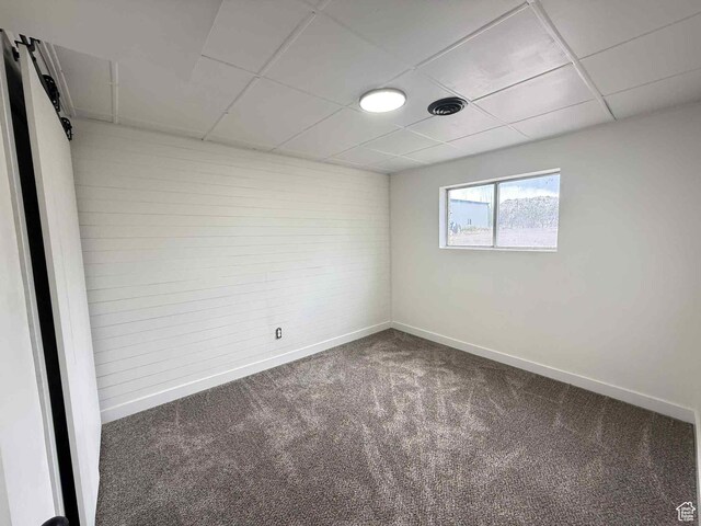 1698 Kenilworth Rd, Helper, UT 84526 - carpeted empty room featuring baseboards and a paneled ceiling