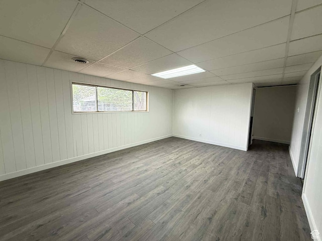 1698 Kenilworth Rd, Helper, UT 84526 - unfurnished room featuring a drop ceiling, dark wood-type flooring, and baseboards
