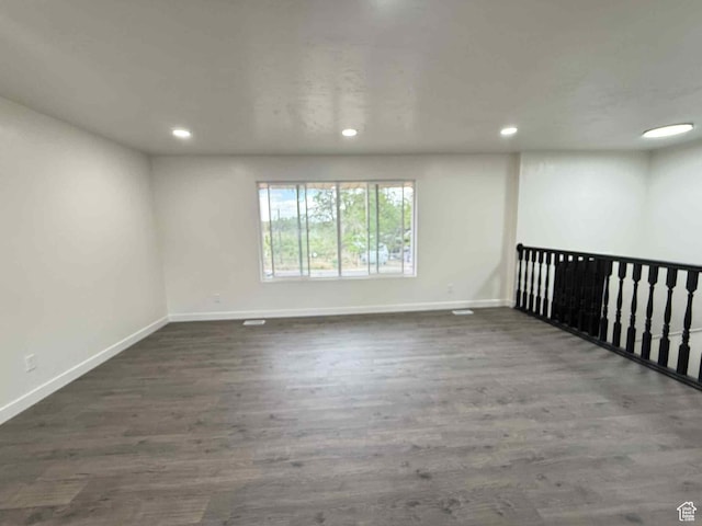 1698 Kenilworth Rd, Helper, UT 84526 - empty room featuring baseboards, recessed lighting, and dark wood-style floors