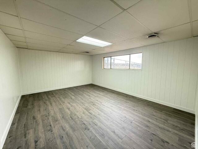 1698 Kenilworth Rd, Helper, UT 84526 - below grade area featuring wood finished floors, a paneled ceiling, baseboards, and wooden walls
