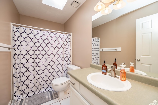 910 W Brandermill Cv, Murray, UT 84123 - bathroom featuring vanity, toilet, tile patterned flooring, a skylight, and curtained shower