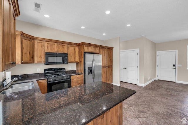 40 W Pecan Ln, Leeds, UT 84746 - kitchen with black appliances, a sink, brown cabinets, recessed lighting, and baseboards