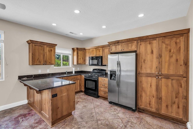 40 W Pecan Ln, Leeds, UT 84746 - kitchen featuring black appliances, a peninsula, brown cabinets, a sink, and recessed lighting