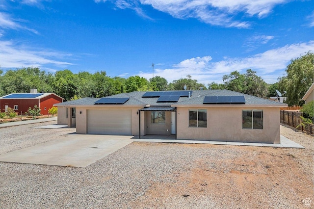 40 W Pecan Ln, Leeds, UT 84746 - view of front facade featuring an attached garage, concrete driveway, stucco siding, and roof with shingles