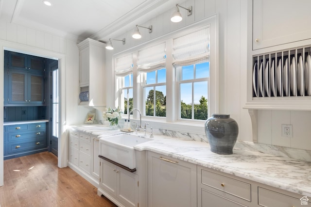 1449 Annie Cir N, Alpine, UT 84004 - kitchen with a sink, white cabinets, light wood-type flooring, crown molding, and light stone counters