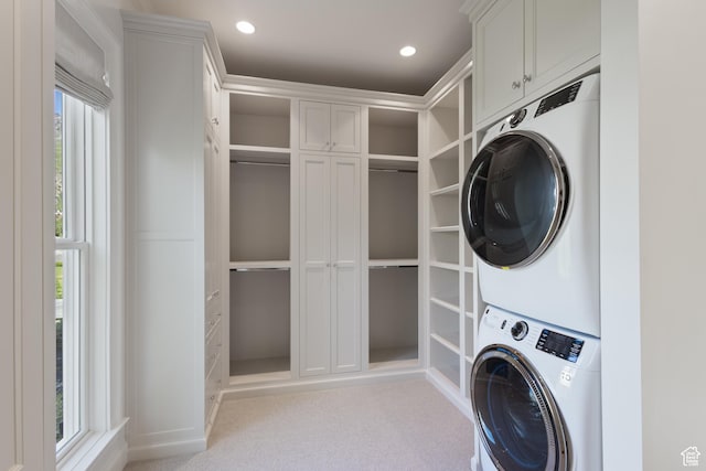1449 Annie Cir N, Alpine, UT 84004 - washroom featuring estacked washer and dryer, carpet floors, recessed lighting, and cabinet space