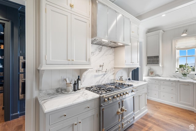 1449 Annie Cir N, Alpine, UT 84004 - kitchen featuring wall chimney exhaust hood, appliances with stainless steel finishes, light wood-style floors, and white cabinets