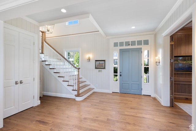 1449 Annie Cir N, Alpine, UT 84004 - foyer entrance with crown molding, stairway, light wood-style flooring, baseboards, and a chandelier