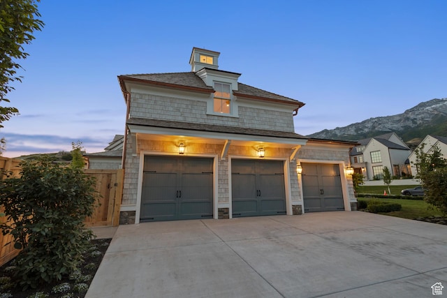 1449 Annie Cir N, Alpine, UT 84004 - view of front of house with stone siding, a mountain view, and concrete driveway