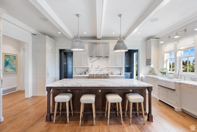 1449 Annie Cir N, Alpine, UT 84004 - kitchen with a sink, exhaust hood, white cabinetry, beamed ceiling, and a large island