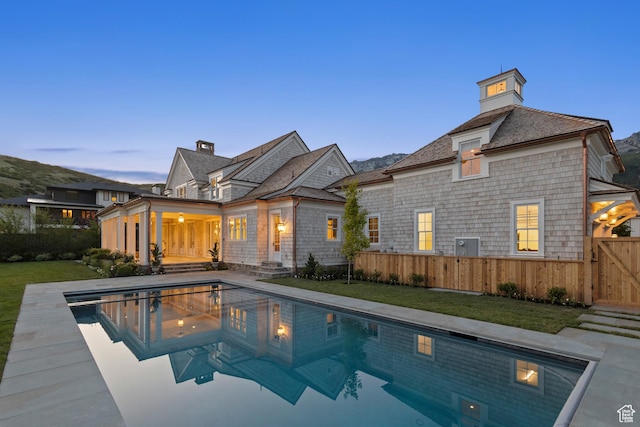 1449 Annie Cir N, Alpine, UT 84004 - pool at dusk featuring a gate